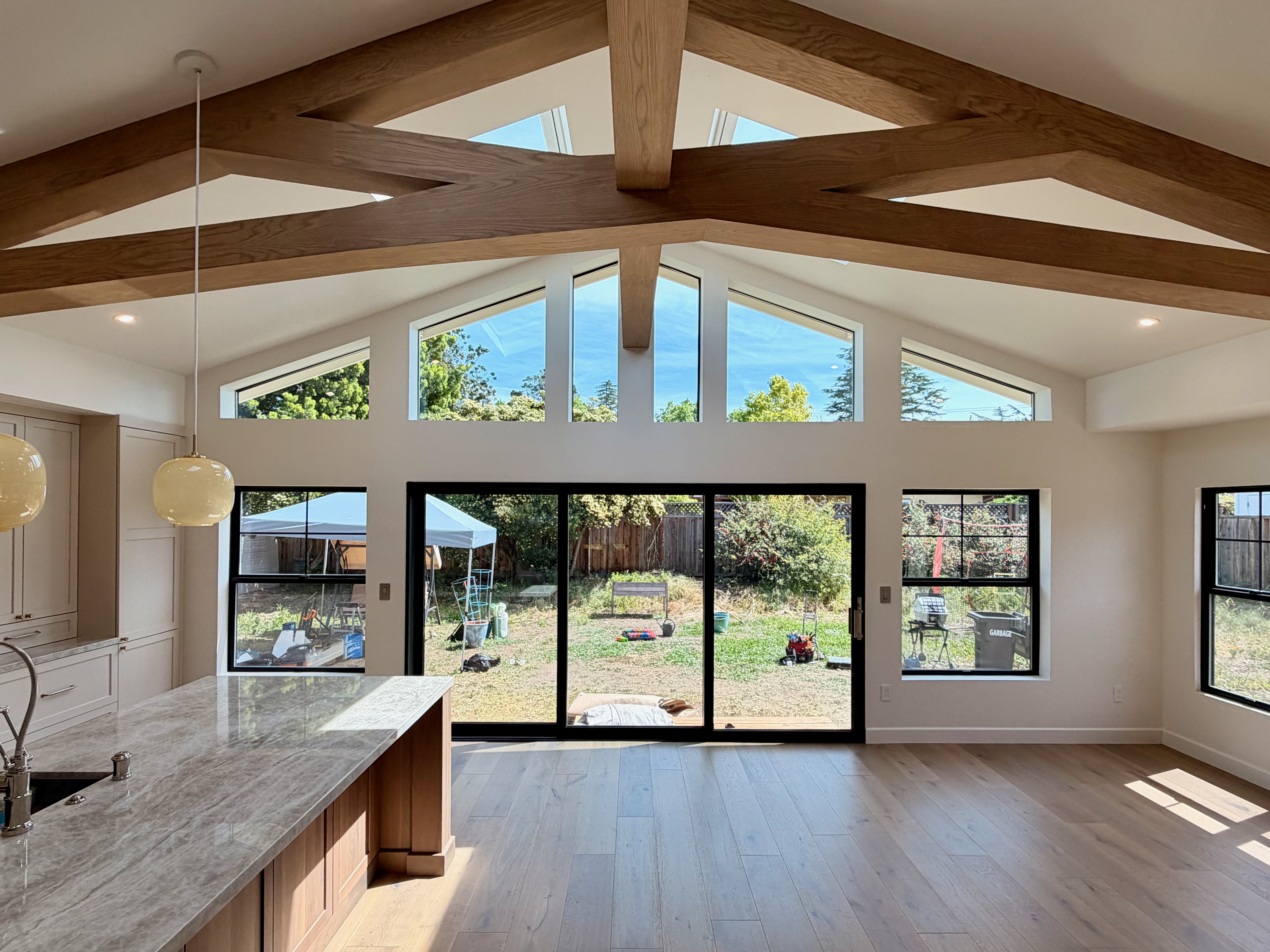 Residential window installation with cathedral ceiling and large glass panels