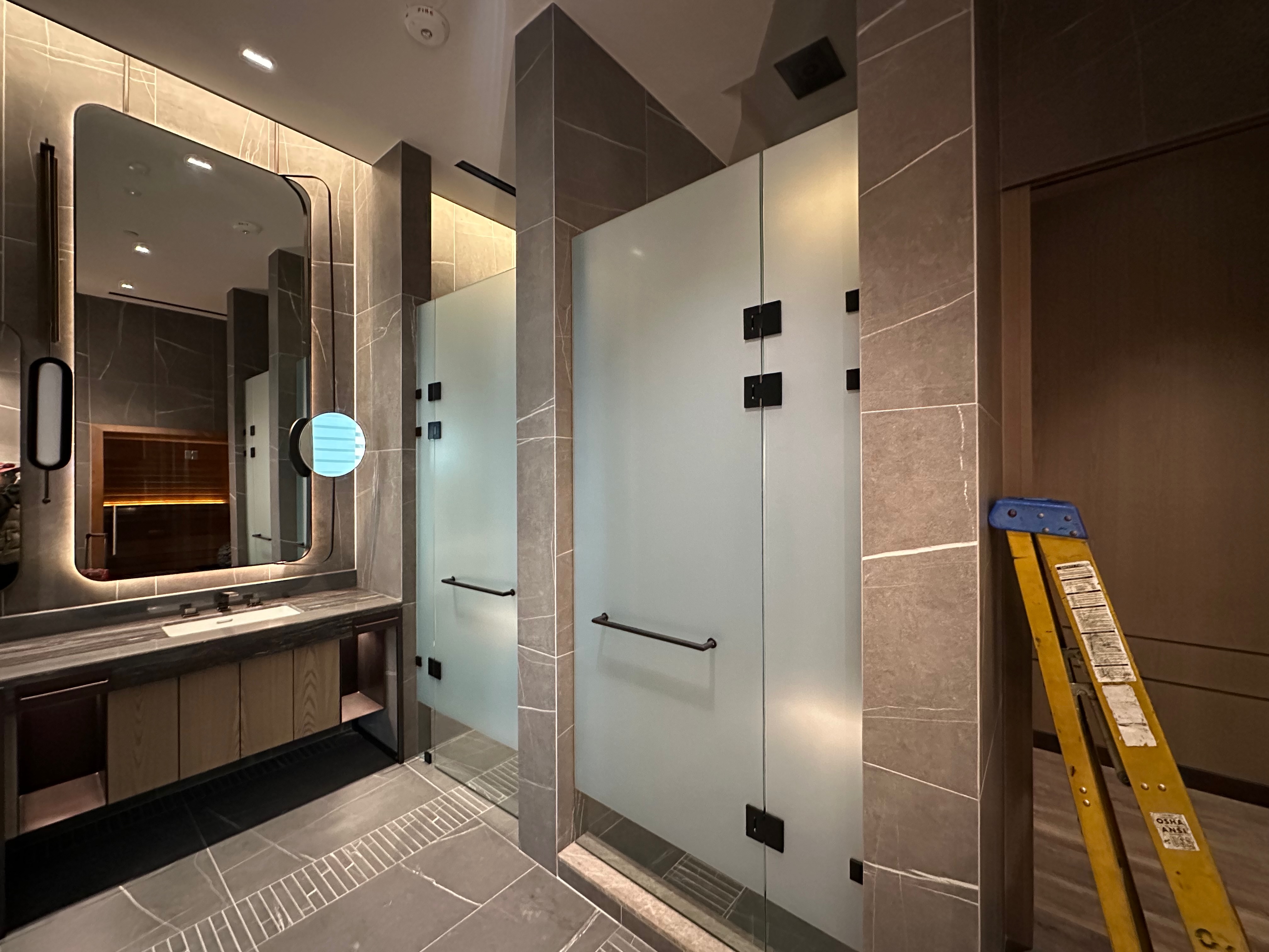 Custom frameless shower enclosure with freestanding tub